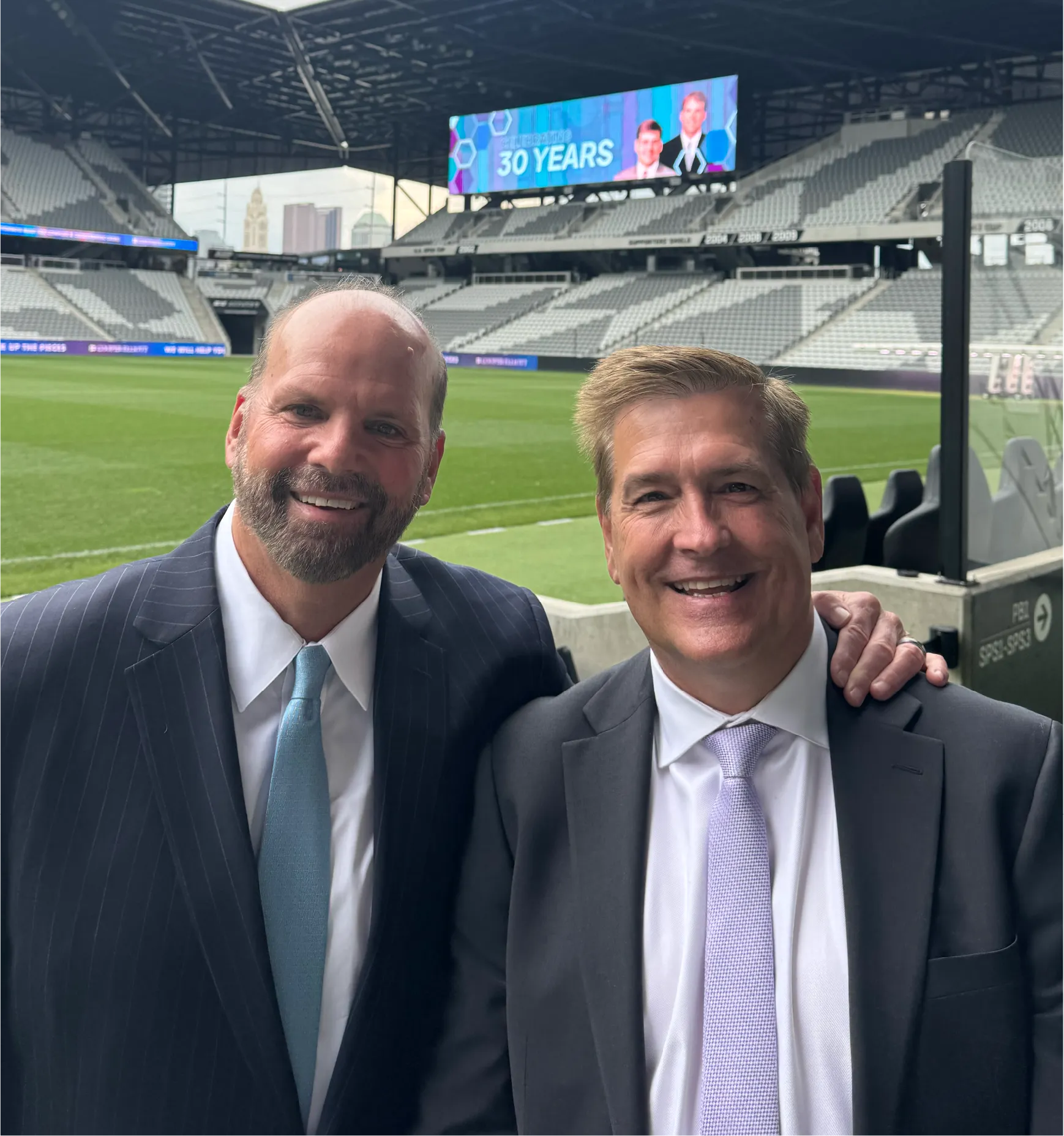 Cooper Elliott attorneys standing together at stadium