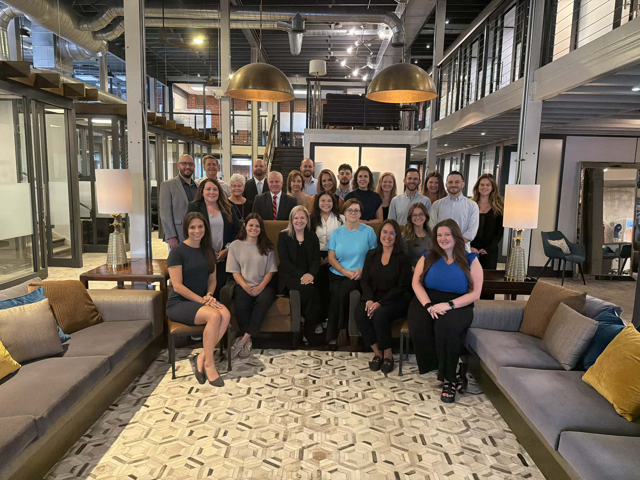 The Cooper Elliott Team gathered in office lobby