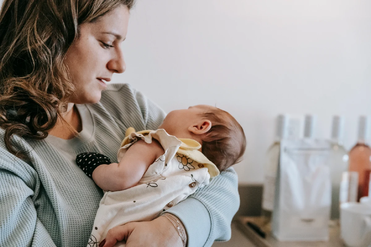 A mother holds a new born close